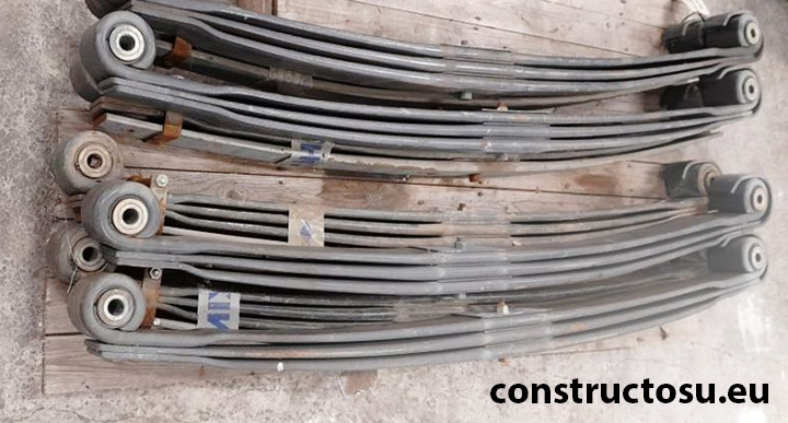 Suspensii pentru tractor articulat și camioane din oțel arcuit